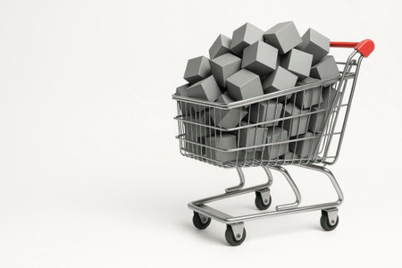 A shopping cart filled with gray cubes on a light background. Space for textの素材