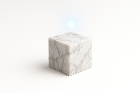A marble cube and a bright light above it. Space for textの素材