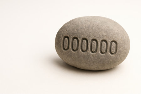 A stone with carved zeros, symbolizing an empty meaning. Space for textの素材