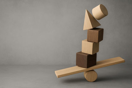 Wooden geometric shapes folded into a delicate balance. Space for textの素材