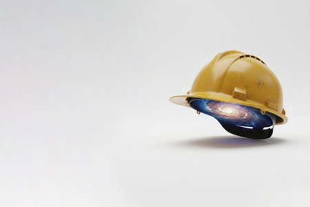 A construction helmet with a galaxy inside. Space for textの素材