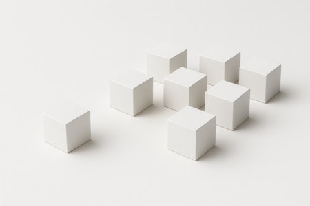 A group of white cubes with one free-standing cube. Space for textの素材