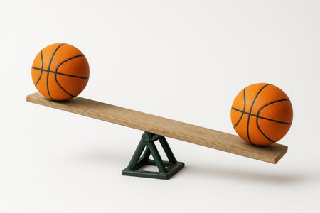 Two basketballs placed on wooden balancer scalesの素材