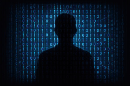 Silhouette of a man in front of a wall with binary codeの素材