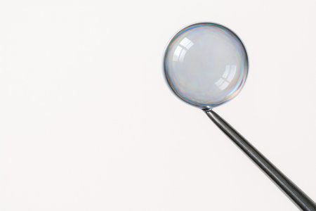 Close-up of a soap bubble on a metal stick. Space for textの素材