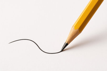 The pencil draws a smooth line on a white sheet. Space for textの素材