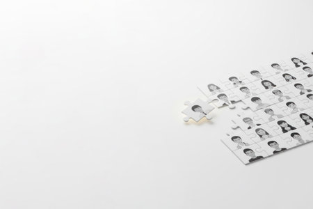 A puzzle with portraits of people and the missing piece. Space for textの素材