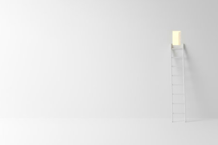 Staircase to a luminous door on a light wall. Space for textの素材