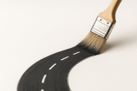 A brush drawing a road on a light background. Space for textの素材