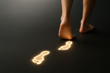 A person leaving glowing footprints on the floor. Space for textの素材