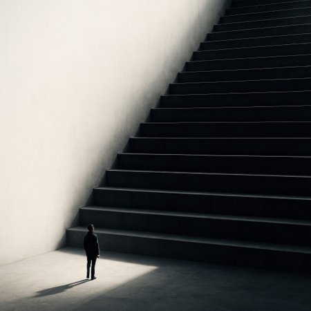 A man at the base of a huge dark staircase. Space for textの素材