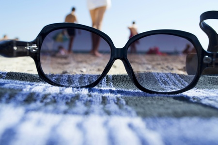 view of the beach through sunglassesの写真素材