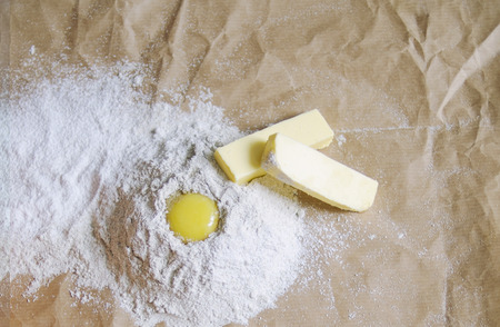 preparation of dough for baking. Eggs, butter and flour.の写真素材