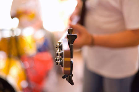 Musician play on bass guitar