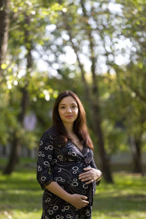 Pregnant woman in park