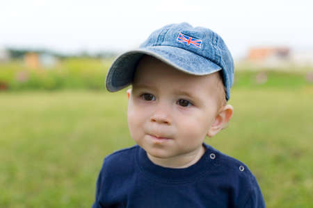 Little boy in hat with interest look forwardの写真素材