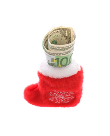 Red christmas sock with euro covering dollars cash money isolated on whiteの写真素材