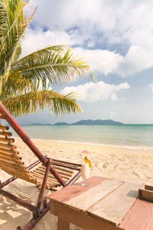 Relaxing under a palm trees with cocktail on loneliness beach. Thailand. Island Koh Changの写真素材