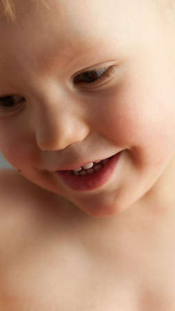 Portrait of emotional pretty little boyの写真素材