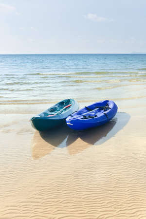 Two kayaks on a tropical beach in Thailandの写真素材