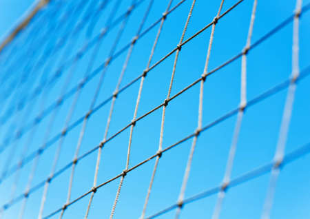 Volleyball net over blue sky