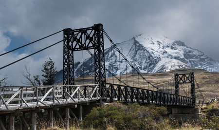 Patagonia mountains, river and bridgeの写真素材