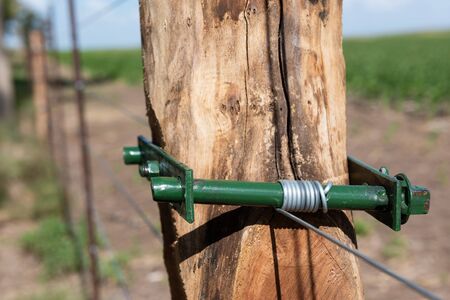 Closeup of rustic wiring in a field of La Pampa, Argentinaの写真素材
