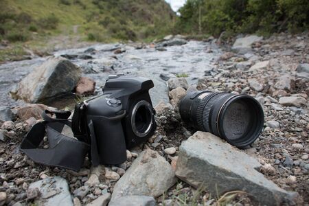 Dslr lens and body fallen and sunken in the river.の写真素材