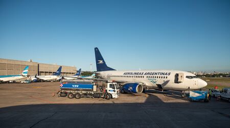 Buenos Aires, Argentina - April 3 2019:  Commercial airplane of Aerolineas Argentinas recharging fuel for a domestic flight in the local airportのeditorial素材