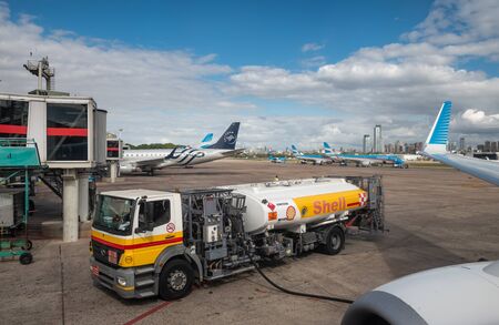 Buenos Aires, Argentina - April 3 2019:  Commercial airplane of Aerolineas Argentinas recharging fuel for a domestic flight in the local airportのeditorial素材