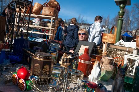 Oslo, Norway - April 11 2010: Norwegian young people selling under the sun celebrating the spring is coming. Olaf Ryes plass.のeditorial素材