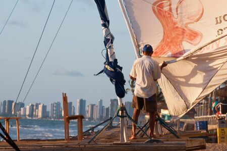 Recife, Brazil - January 11 2009: A tipical brazilian jangada and the sailor, a Jangada is a traditional fishing boat or sailing raft made of wood used in the northern region of Brazil.のeditorial素材