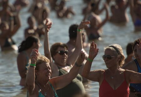 Buenos Aires, Argentina - January 29 2017: Inhabitants of the city of CarhuÃ©, trying to achieve a new world record Guinness for the largest number of people floating at the same time, and they succeeded. This record was possible thanks to the salinity ofのeditorial素材