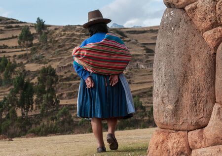 Chincheros, Peru - July 31 2011: A typical woman coya walking to her village.のeditorial素材