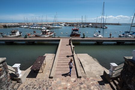 Piriapolis, Uruguay - March 4 2016: Harbor and marina with fishing boats and sailboats.のeditorial素材