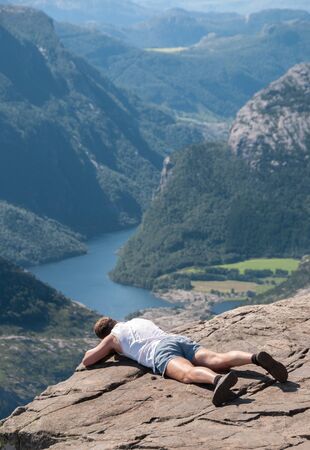 Preikestolen, Norway - August 1 2008: People trying to see the fiord from de top of Preikestolen.のeditorial素材