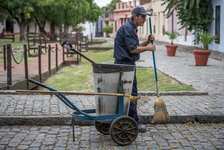 Colonia, Uruguay - March 2 2016: Man sweeper working on the streets of Colonia.のeditorial素材