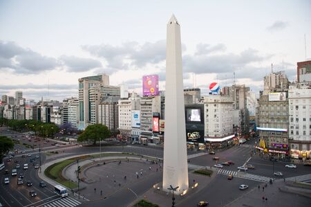 Buenos Aires, Argentina - November 12 2012: Pedestrian and traffic on the sreets of Buenos Aires city. This photo shows the downtown and de 9 de Julio Avenue arround the obelisc.のeditorial素材