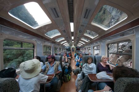 Cuzco, Peru - August 19 2011: Inside a train and passengers from Macchu Pichu to Cuzco