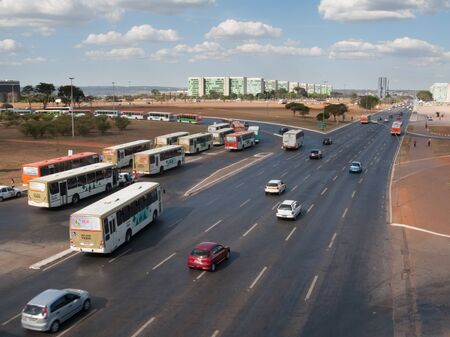 Brasilia, Brazil - July 24 2009: A main avenue in Brazilia called Eixo Monumental. Transportation in Brazil, bus and buildings.のeditorial素材