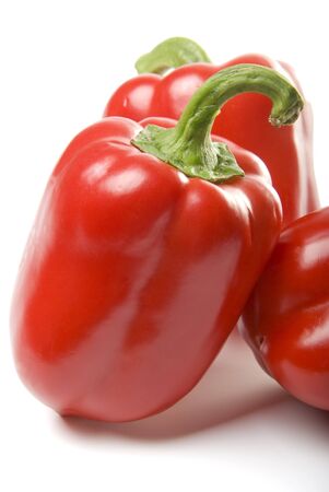 There are a red bulgarians sweet peppers on the white backgroundの写真素材