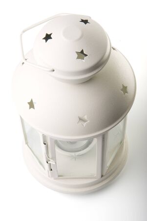there is a white candle lamp on the white backgroundの写真素材