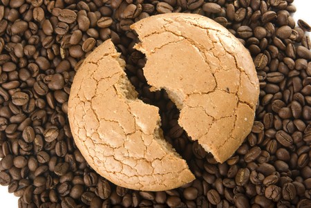 The broken macaroon on the coffee grainの写真素材