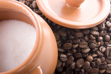 There is a pot of sugar on the coffeeの写真素材