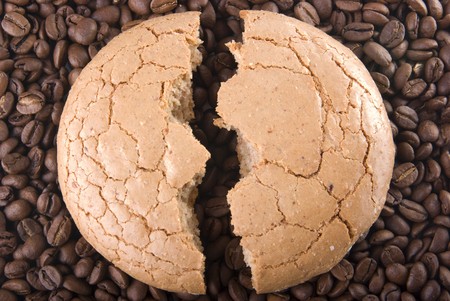 The broken macaroon on the coffee grainの写真素材