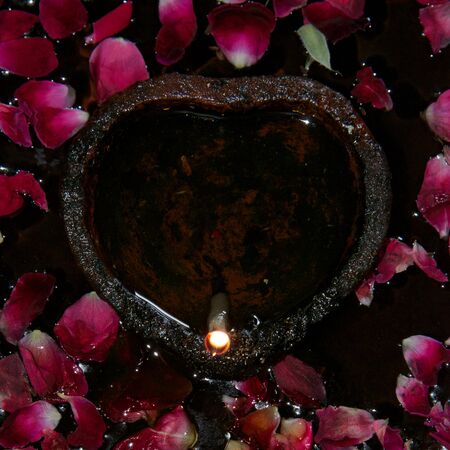 Heart-shaped night light with petalsの写真素材