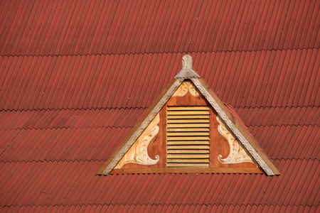 Dormer window in red corrugated iron roofの写真素材