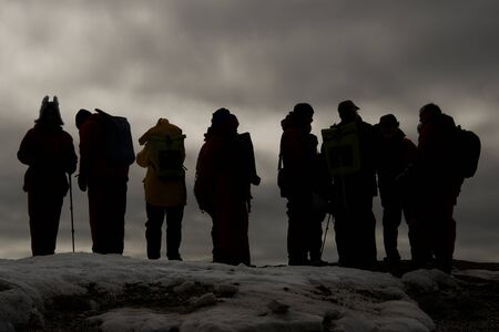 Black and white silhouette of eight peopleの写真素材