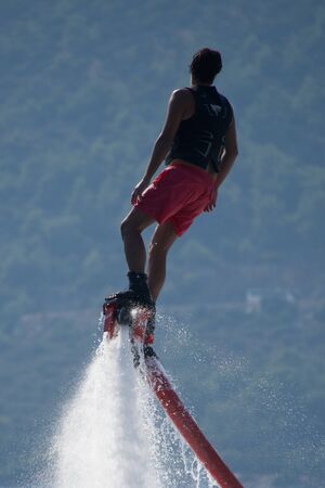 Close-up of Flyboarder leaning backwards before turn