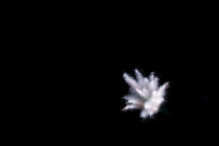 Abstract white firework burst using focus pull